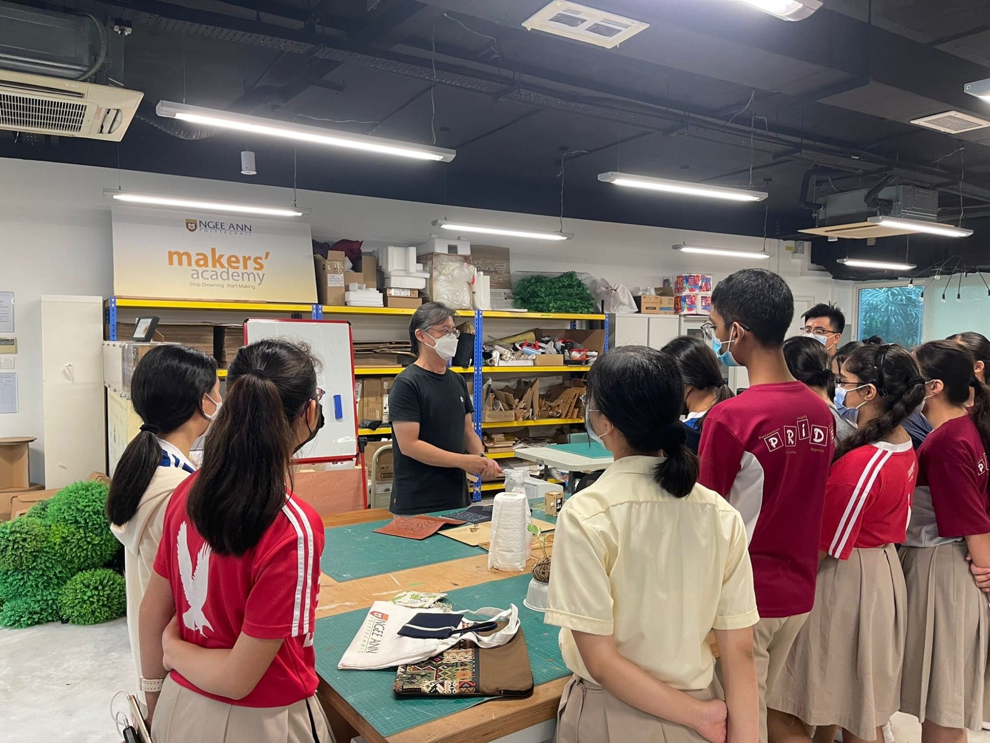 An instructor addresses a group of students in the Ngee Ann Polytechnic Makers' Academy workshop.